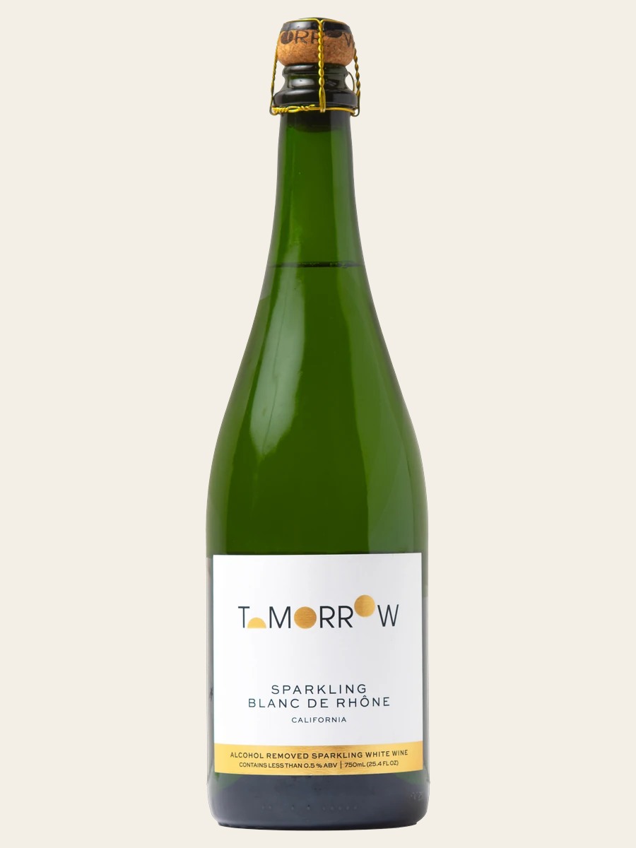 Tomorrow Cellars Sparkling Blanc de Rhône, one complete green bottle with a cork, wire cage and white-and-gold front label